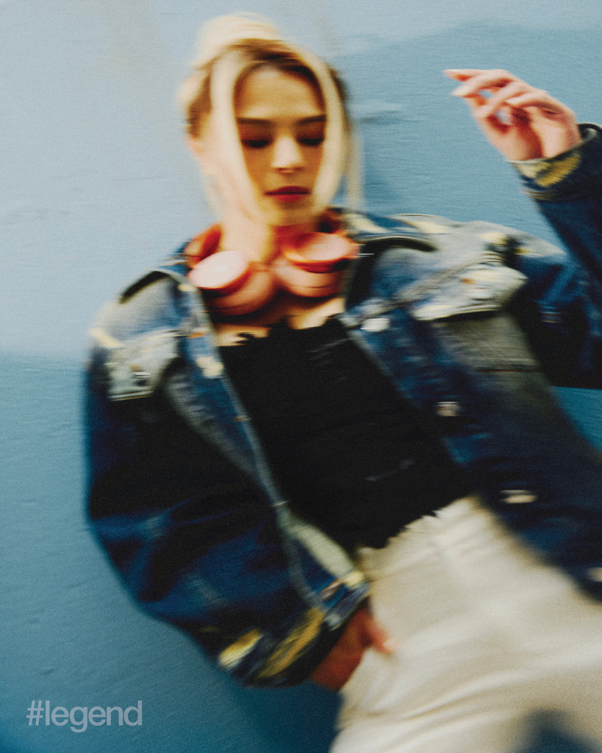 Blue repair fluted denim jacket _ Marc Jacobs; Black denim top with printed details; White high-waisted trousers with pockets _ Shiatzy Chen. Headphones: Bang & Olufsen Beoplay H100