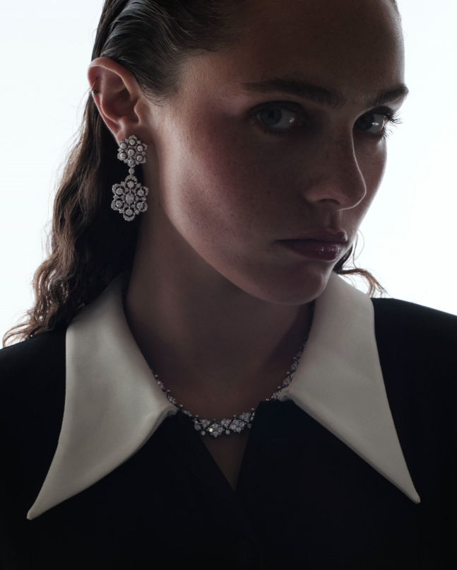 Necklace and earrings _ Buccellati; Black dress with white collar detail _ Versace