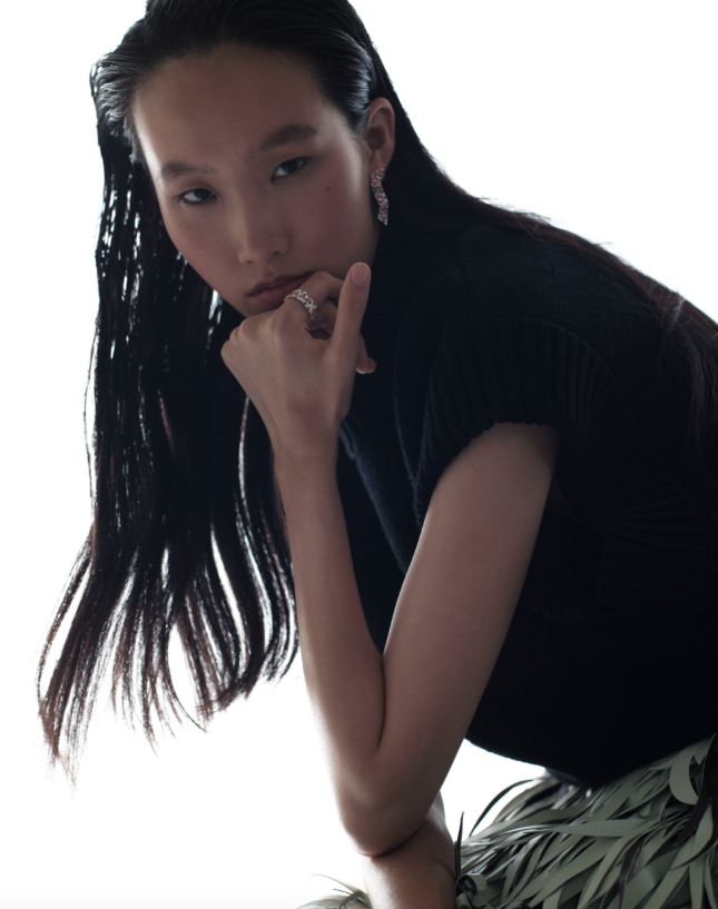 Earrings and ring _ Dior Joaillerie; Blue sleeveless top and green skirt _ Bottega Veneta