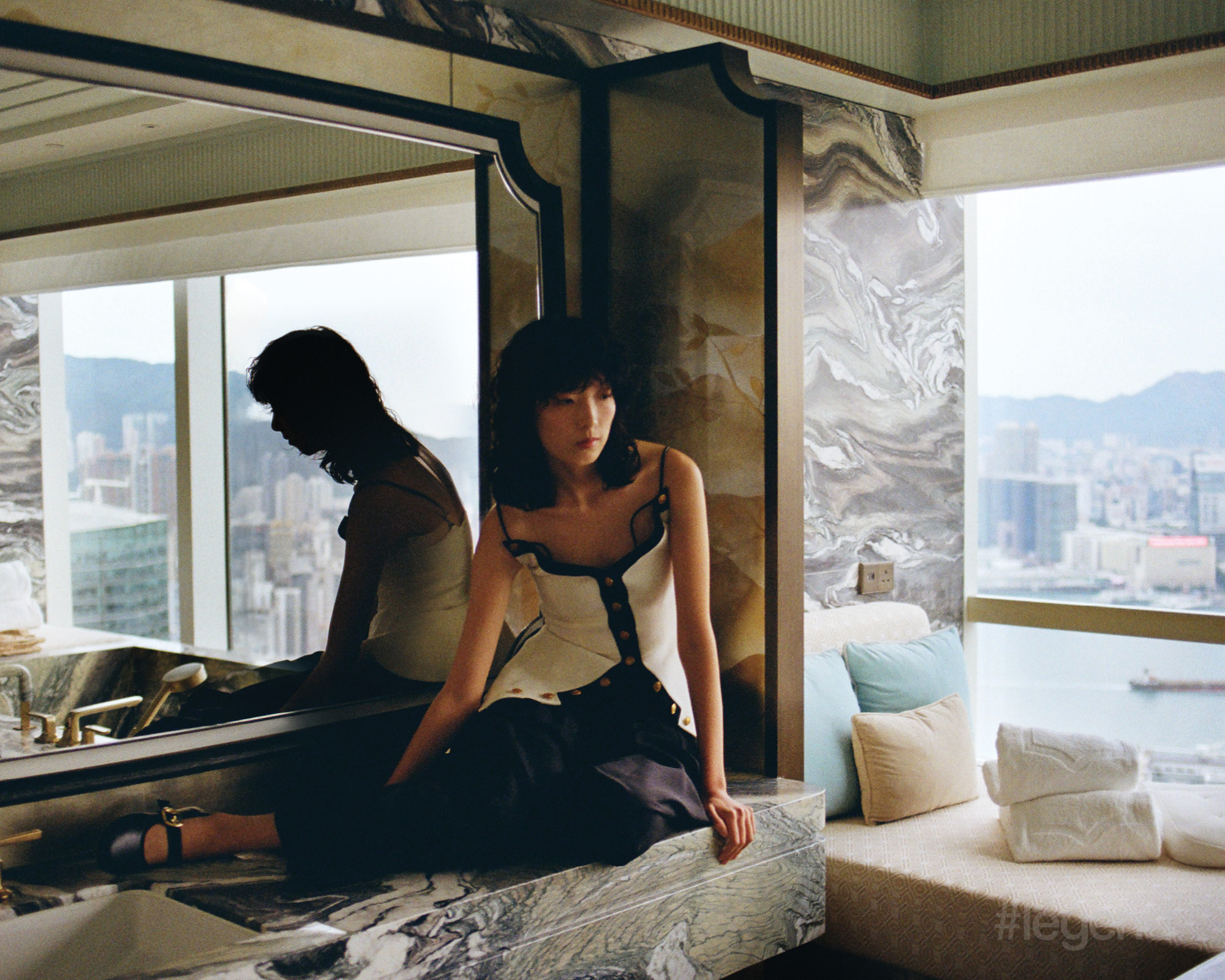 White and black buttoned peplum top, and black trousers and flats _ Louis Vuitton