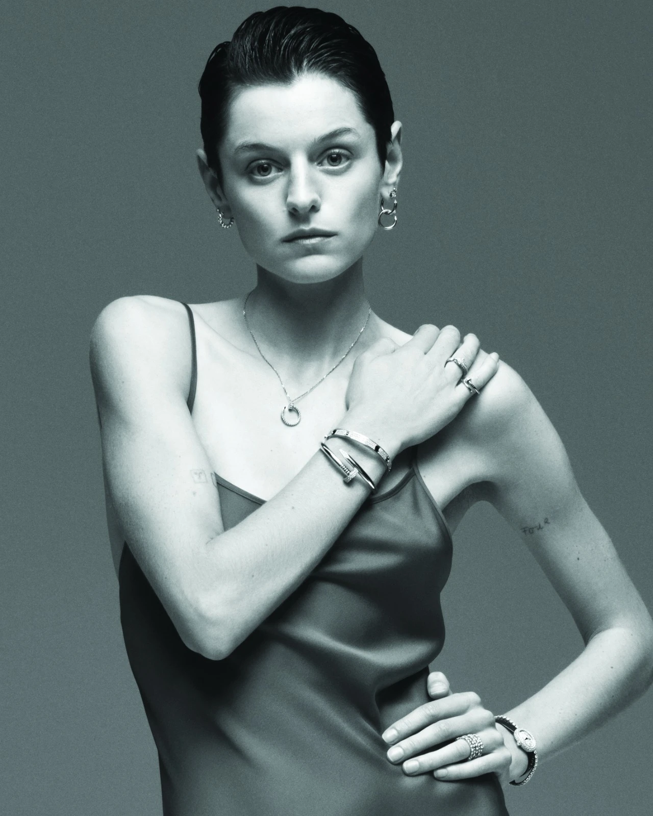  Baignoire watch: Mini Model; white gold; diamonds; navy blue calfskin strap. Panthère de Cartier ring: White gold; onyx, emeralds, diamonds. LOVE bracelet: White gold; black ceramic, diamonds. Juste un Clou bracelet: White gold; diamonds. Juste un Clou necklace: White gold; diamonds. Juste un Clou earrings: Pink gold; diamonds. Clash de Cartier earrings: Mini model; white gold. Essential Lines ring: White gold; diamonds. Reflection de Cartier bracelet: White gold; diamonds. Juste un Clou ring: Small model; white gold.