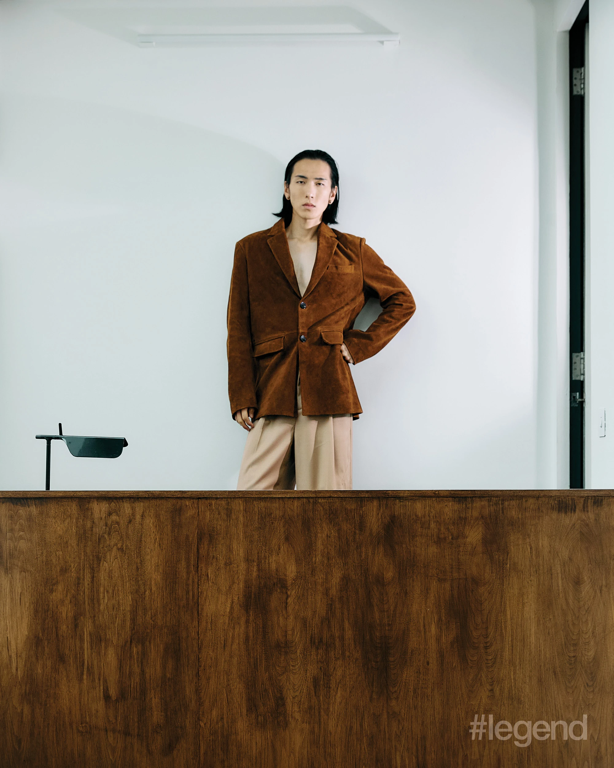   fashion Green coat, and black top and shoes _ Gucci Brown blazer and beige trousers _ Feng Chen Wang