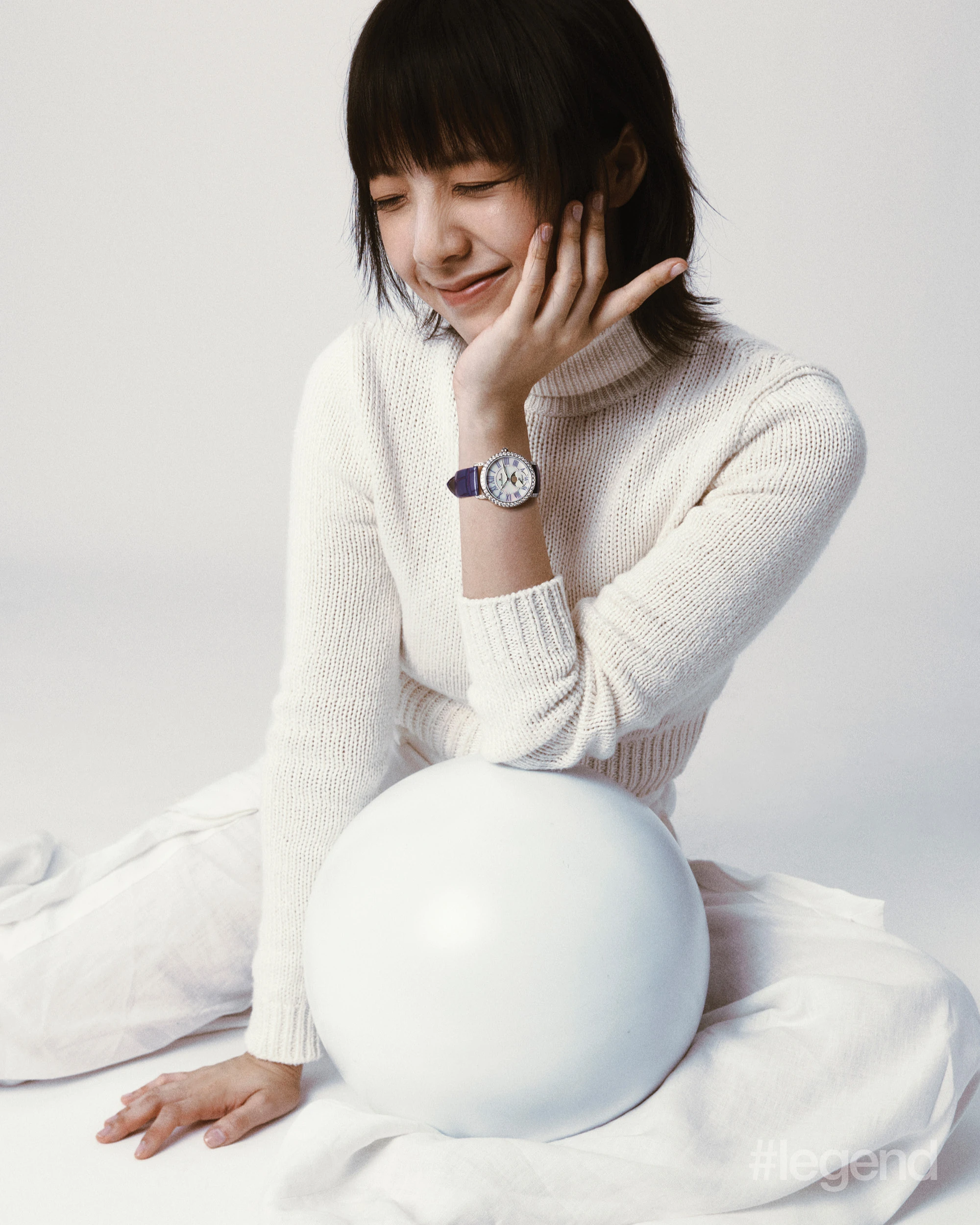 White knit turtleneck and trousers _ Ralph Lauren; Ladybird Colors Phases de Lune _ Blancpain
