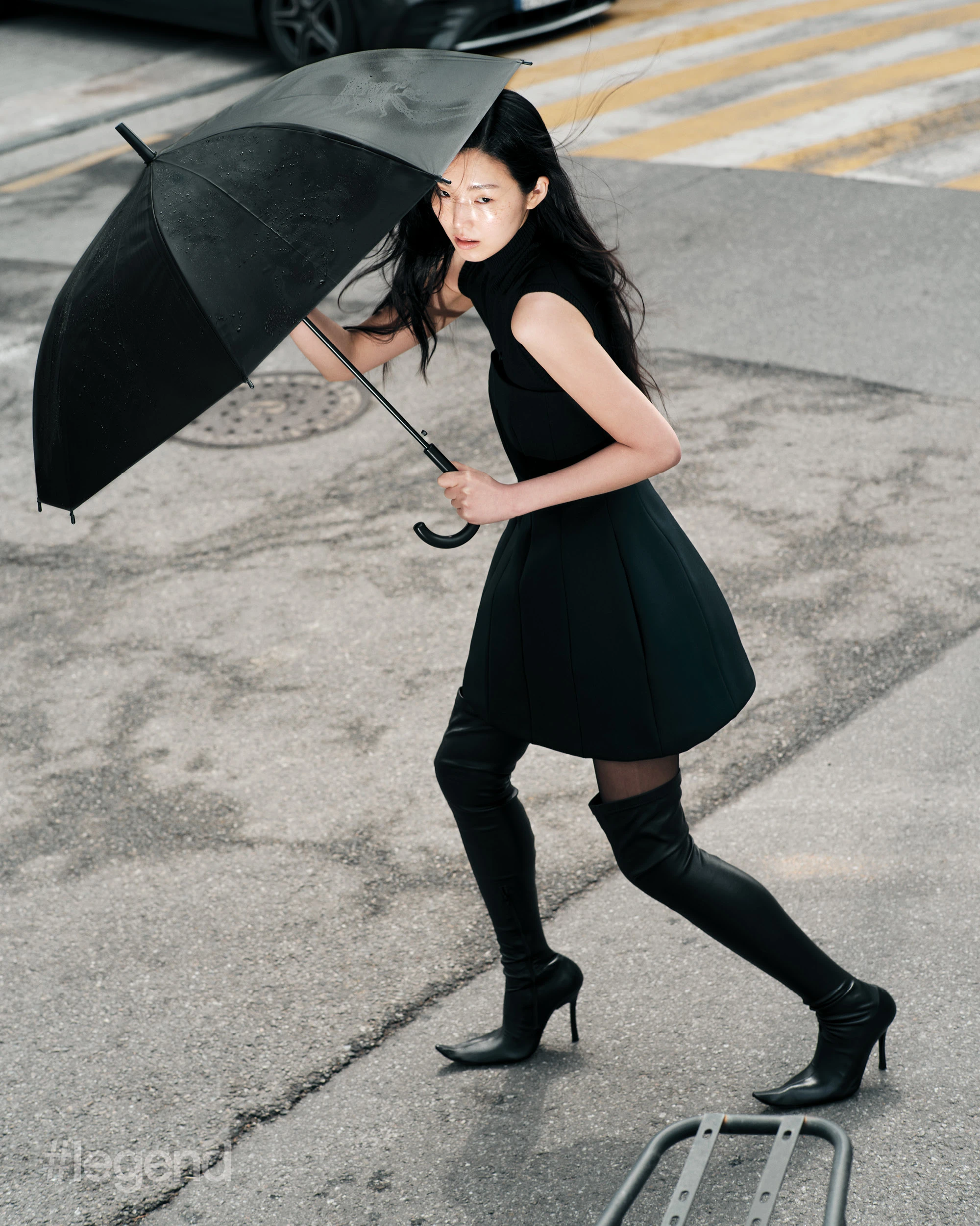 Black sleeveless turtleneck _ Sportmax; Black strapless dress _ Max Mara; Black thigh-high boots _ Balenciaga