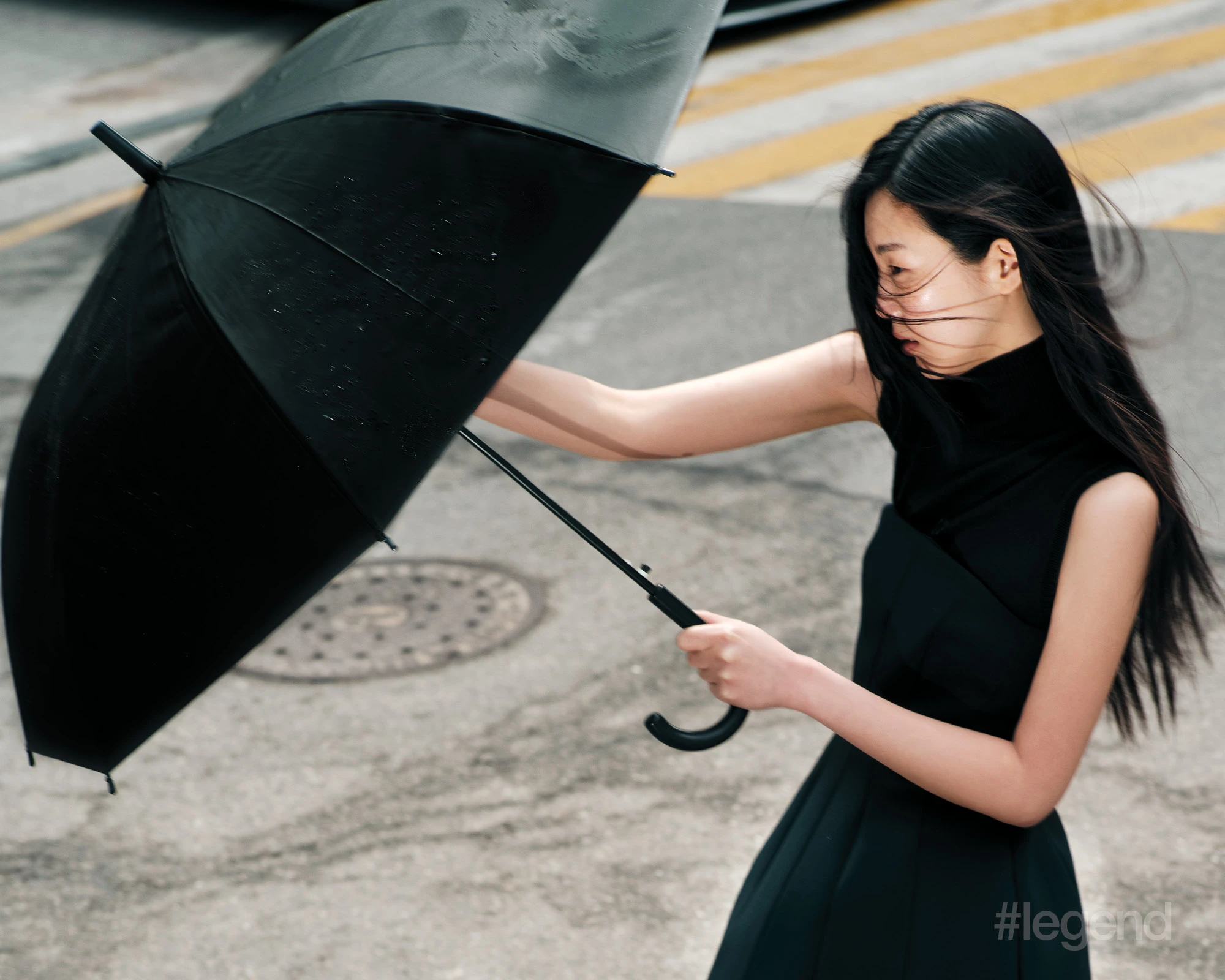 Black sleeveless turtleneck _ Sportmax; Black strapless dress _ Max Mara